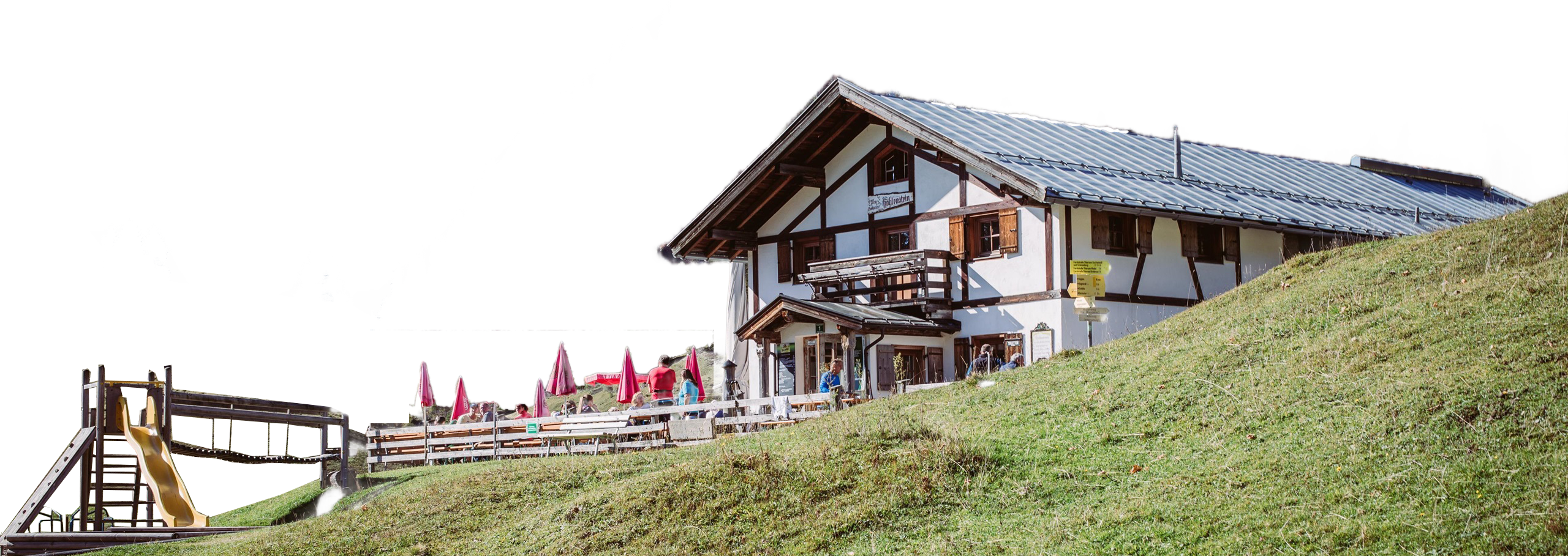 Almgasthaus Höhlenstein im Tiroler Inntal mit Bergpanorama und Herbstlaub
